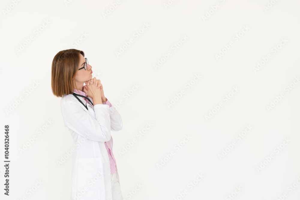 Female doctor standing and pointing on free space isolated on white background Female doctor standing and pointing on free space isolated on white background