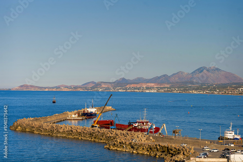 Croastal harbor with mountains in the distance photo