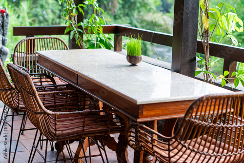 Serene Outdoor Table with Grass and Decorative Statue
