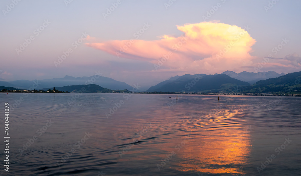 Fototapeta premium Sunset view of the Upper Zurich Lake from the historical Holzbrücke, St. Gallen, Switzerland