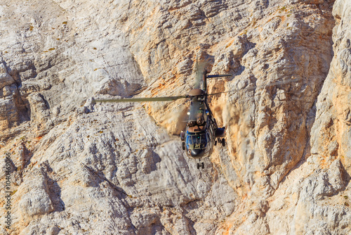 Slovenian military helicopter flying in the slovenian alps julian alps