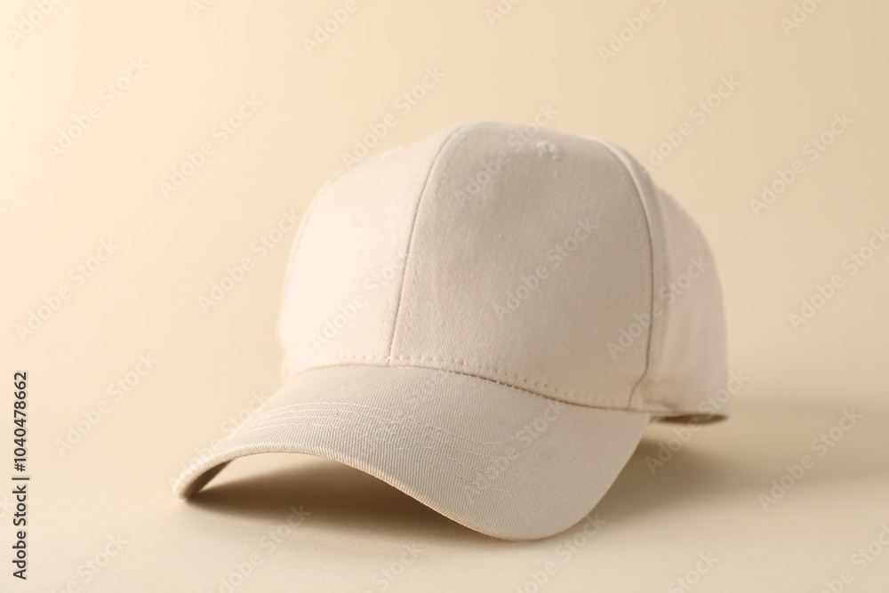 Stylish baseball cap on beige background, closeup. Mockup for design Stylish baseball cap on beige background, closeup. Mockup for design
