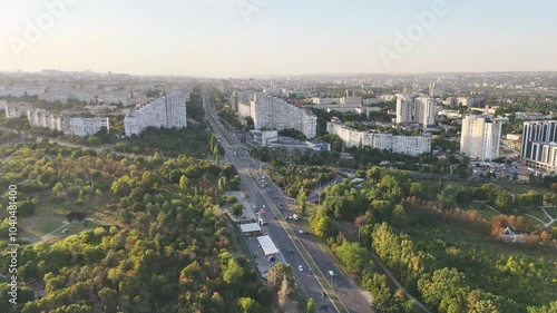 Aerial panoramic view of the Chisinau city at sunset, Moldova. Botanica district and its main road Bulevardul Dacia photo