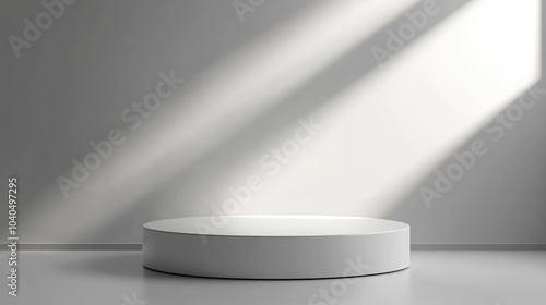 Minimalist studio display with circular platform and dramatic lighting effects