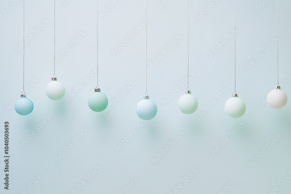 Minimalist hanging elegant pastel Christmas balls on beige pastel color Minimalist hanging elegant pastel Christmas balls on beige pastel color
