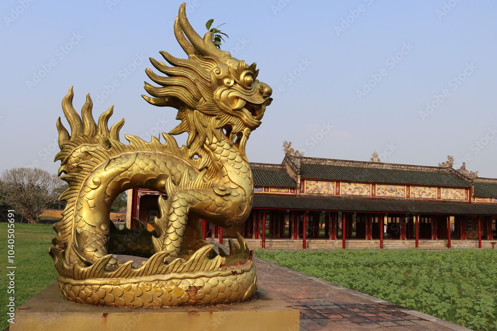 golden dragon statue inside ancient city of Hue golden dragon statue inside ancient city of Hue