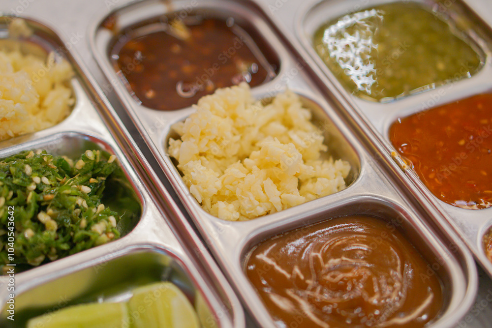 A set of various dipping sauces. A bowl for various dipping sauces. A set of various dipping sauces in various colors. A set of various dipping sauces. A bowl for various dipping sauces. A set of various dipping sauces in various colors.
