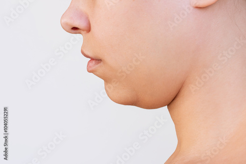 Bild auf Leinwand Profile of a young caucasian woman with double chin isolated on a white background