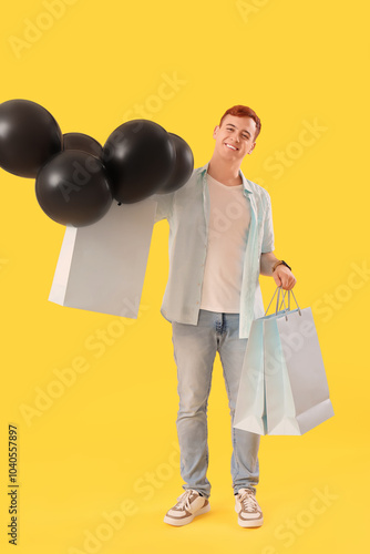 Happy young redhead man wit...