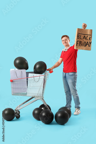 Young redhead man with bags...