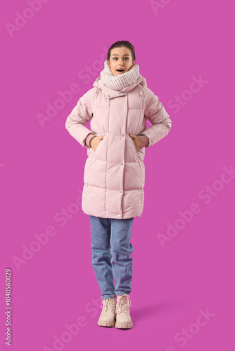 Young woman in down coat on...