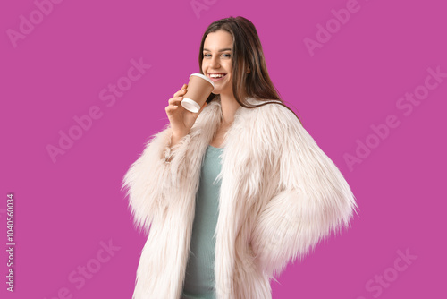 Young woman in fur coat dri...