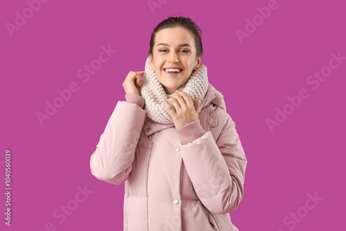 Young woman in down coat on...