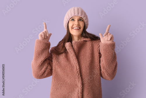 Young woman in teddy coat p...