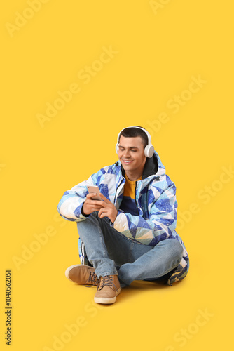 Young man in warm jacket wi...