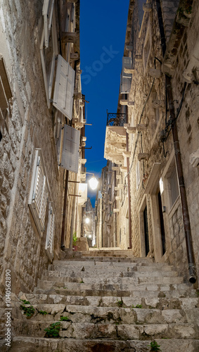 A narrow steep street of the old town in Dubrovnik at night, Croatia.