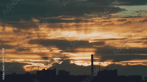 Rain clouds at sunset over the city