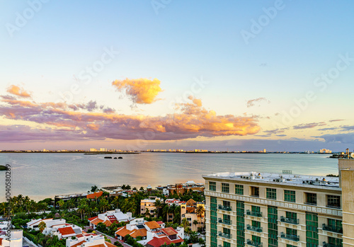 Nichupte Lagoon is one of the best examples of natural paradise. Sunrise on the tropical beach of Cancun in Mexico. Beautiful shining clouds photo