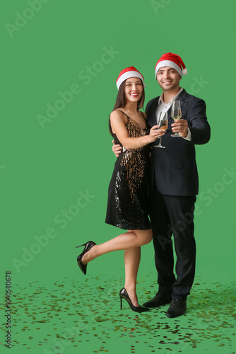 Young couple in Santa hats ...