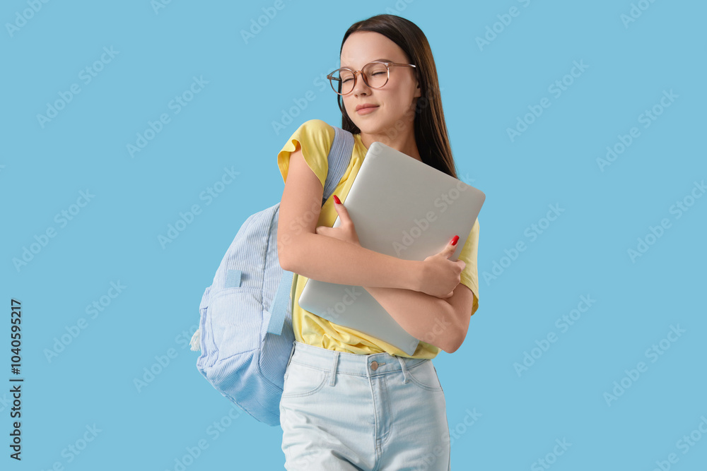 Female student with laptop and backpack on blue background Female student with laptop and backpack on blue background