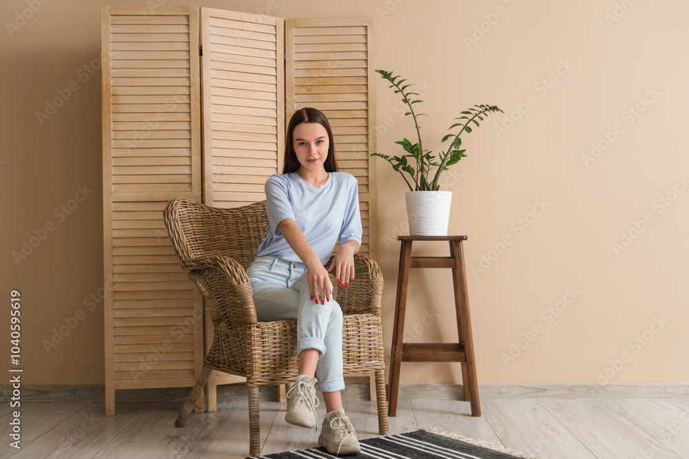 Teenage girl sitting in wicker armchair at home Teenage girl sitting in wicker armchair at home