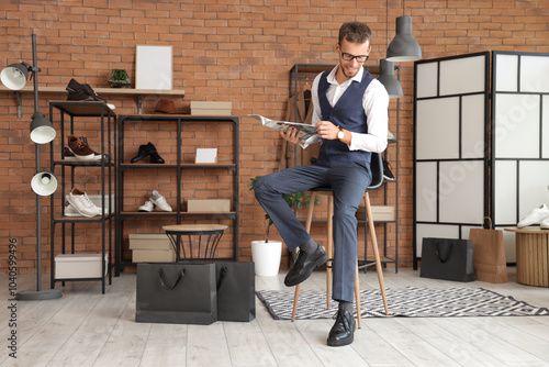 Young businessman reading m...