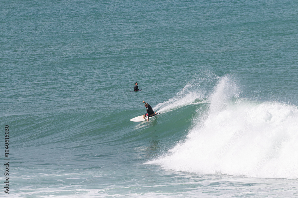 Surfer perfoming a backend turn in VVF, Anse l'etang, tartane, Martinique, West Indies, France Surfer perfoming a backend turn in VVF, Anse l'etang, tartane, Martinique, West Indies, France