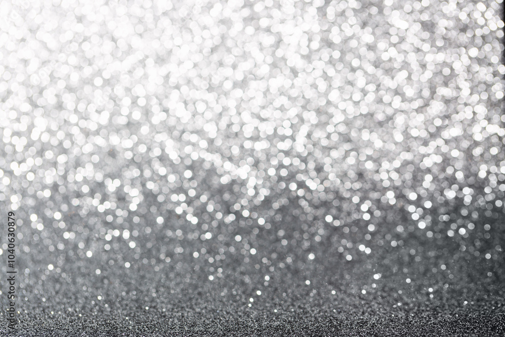 Metallic foil background. Shiny metal silver foil texture abstract defocused background. Sparkle glitter texture with bokeh lights. Holiday Christmas image. Metallic foil background. Shiny metal silver foil texture abstract defocused background. Sparkle glitter texture with bokeh lights. Holiday Christmas image.