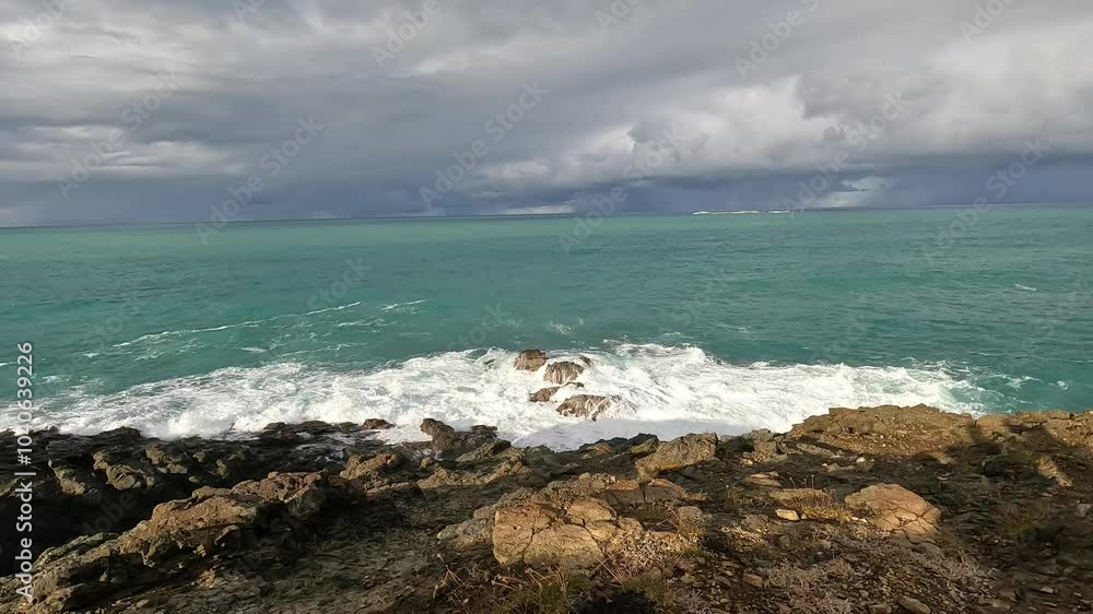 waves crashing over rocks on the coast of puerto rico (san juan fajardo) rocky beach (caribbean sea) island travel tourism nature storm stormy weather dark clouds empty paradise trouble ocean water waves crashing over rocks on the coast of puerto rico (san juan fajardo) rocky beach (caribbean sea) island travel tourism nature storm stormy weather dark clouds empty paradise trouble ocean water