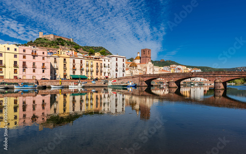 Beautiful view of the picturesque town of Bosa with its colorful houses reflected in the Temo River, Sardinia, Italy.
