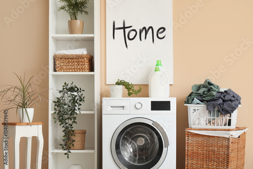 Interior of laundry room with clothes baskets, washing machine and shelving unit