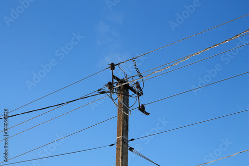 Power lines are covered in ice. Ice on the wires