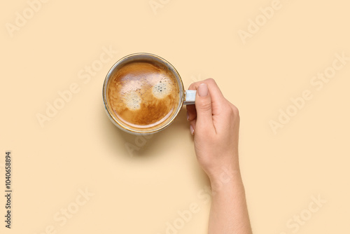 Female hand with cup of cof...