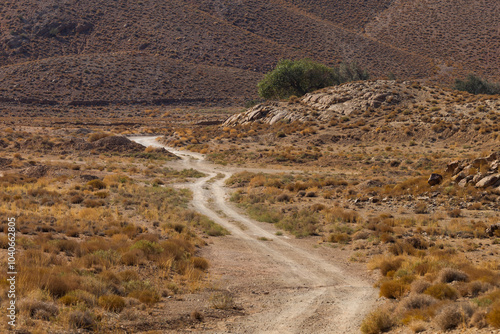 Canvastavla A dirt path toward foothills in a hot and dry far-flung location in central desert of Iran