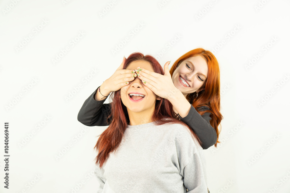 Happy bright positive moments of two stylish girls hugging each other and smiling. Close Up portrait funny joyful attractive young women having fun, lovely moments, best friends. Happy bright positive moments of two stylish girls hugging each other and smiling. Close Up portrait funny joyful attractive young women having fun, lovely moments, best friends.