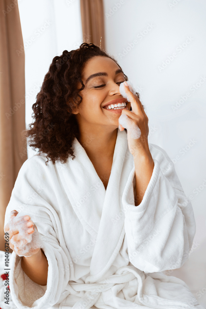 Childish african woman playing with bath foam in bathroom at home, having fun on weekend Childish african woman playing with bath foam in bathroom at home, having fun on weekend