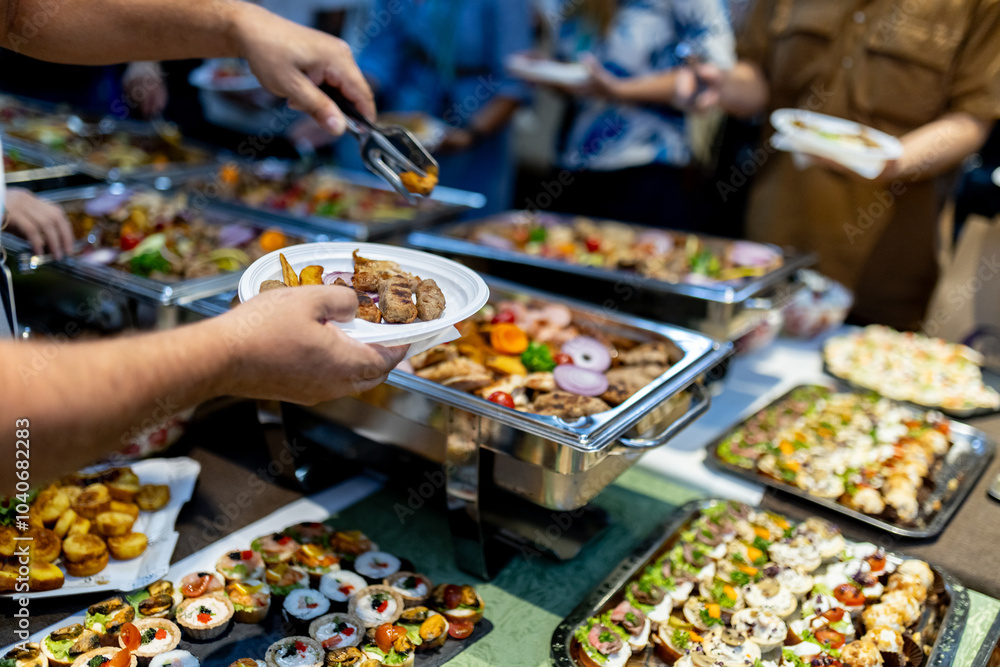 Buffet dining experience with diverse food selection during an evening gathering in a festive atmosphere Buffet dining experience with diverse food selection during an evening gathering in a festive atmosphere