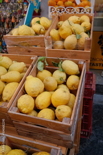 Wallpaper Mural A wooden box filled with fresh, vibrant yellow lemons from the Amalfi Coast, displayed at a local market. The bright citrus fruits capture the essence of Italian freshness and flavor. Torontodigital.ca
