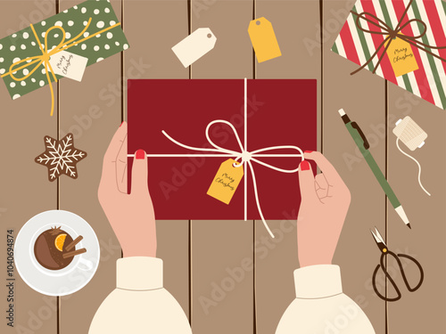 Christmas preparation concept featuring gift wrapping from top view with hands. Vector background for festive designs, holiday packaging, and seasonal promotional content
