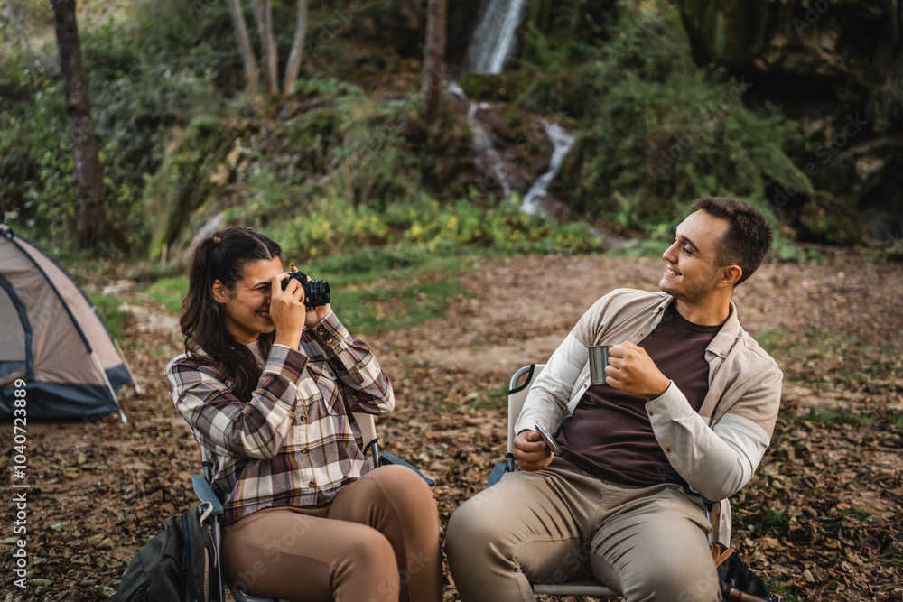 Happy campers enjoying nature at a scenic forest campsite moment Happy campers enjoying nature at a scenic forest campsite moment