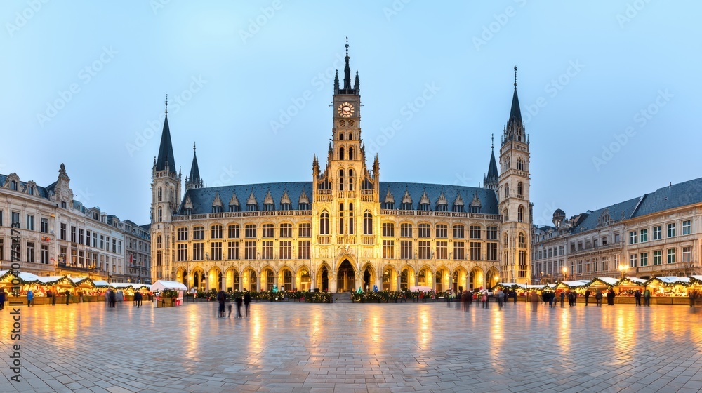 Illuminated Bruges Medieval Town Hall and Clock Tower in Historic Market Square at Night Illuminated Bruges Medieval Town Hall and Clock Tower in Historic Market Square at Night