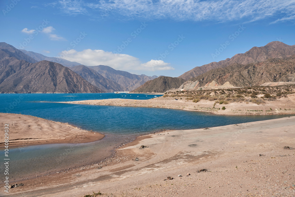 Landscape of Potrerillos, Mendoza, Argentina. In the foreground the reservoir and in the background the Andes mountains. Landscape of Potrerillos, Mendoza, Argentina. In the foreground the reservoir and in the background the Andes mountains.