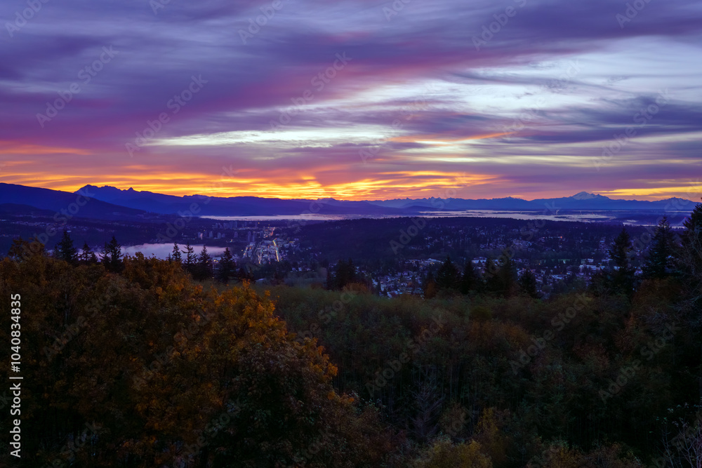 Sunrise over Fraser Valley, BC, with mountains in silhouette on horizon. Sunrise over Fraser Valley, BC, with mountains in silhouette on horizon.