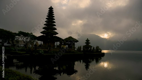 Pura Ulu Danau Temple Bali travel Indonesia Destination Exotic Place of worship in Silhouette. Lake temple Indonesian Culture Tranquil Scene Idyllic Tourism Balinese Hinduism Pagoda Beauty In Nature photo