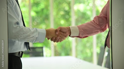 Team Business Partners shaking hands together to Greeting Start up small business in meeting room. Shakehand teamwork partners at modern office handshake together. Business mergers and acquisitions