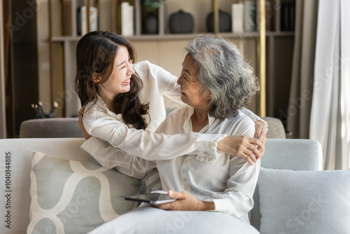 Portrait of enjoy happy love asian family senior mature mother and young daughter smiling play laughing and having fun together at home, care, elderly, insurance.happy family and Mother Day concept