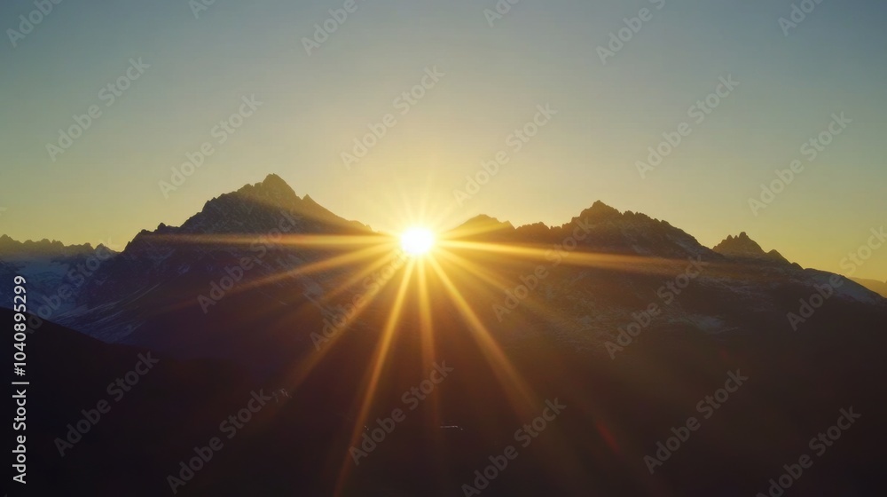 Obraz premium Sunrise Over Mountain Peaks, a breathtaking timelapse capturing the sun's ascent and its glow on distant rugged summits.