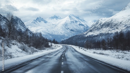 Serene Road Through Snowy Mountain Landscape