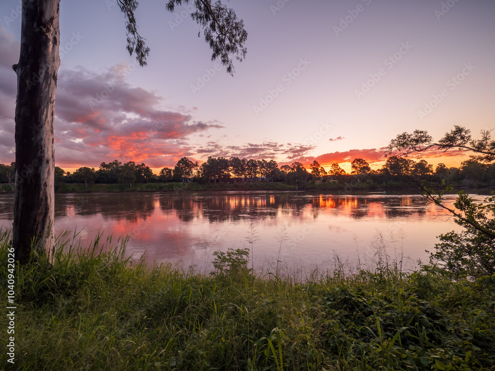 Naklejka premium Sunset by the River with Reflections