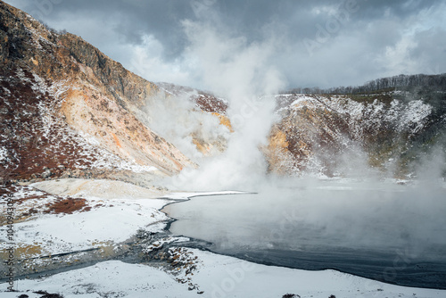 Steam hot springs and snow scene in Noboribetsu Hell Valley, Hokkaido, Japan photo